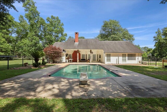 265 Callie Ln, Orange, TX 77632 - back of house with a patio and a chimney