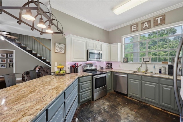 265 Callie Ln, Orange, TX 77632 - kitchen featuring stainless steel appliances, a sink, backsplash, white cabinets, and light stone counters