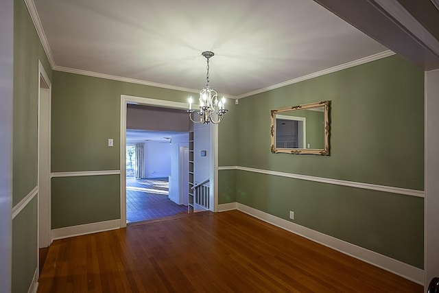 unfurnished dining area featuring hardwood / wood-style flooring, an inviting chandelier, and crown molding