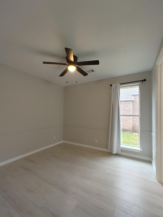 unfurnished room with light hardwood / wood-style flooring and ceiling fan