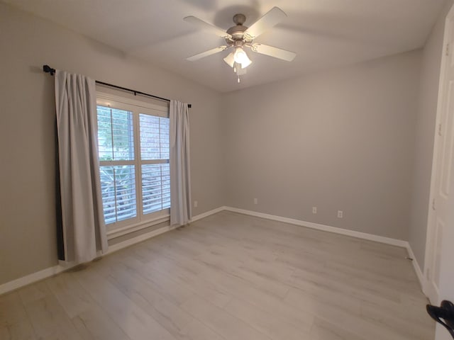 unfurnished room with ceiling fan and light hardwood / wood-style floors