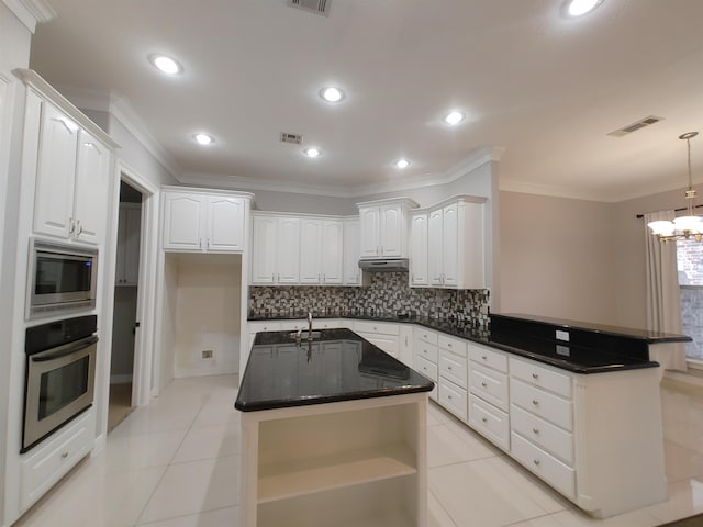 kitchen featuring a kitchen island with sink, light tile patterned floors, stainless steel appliances, and white cabinets