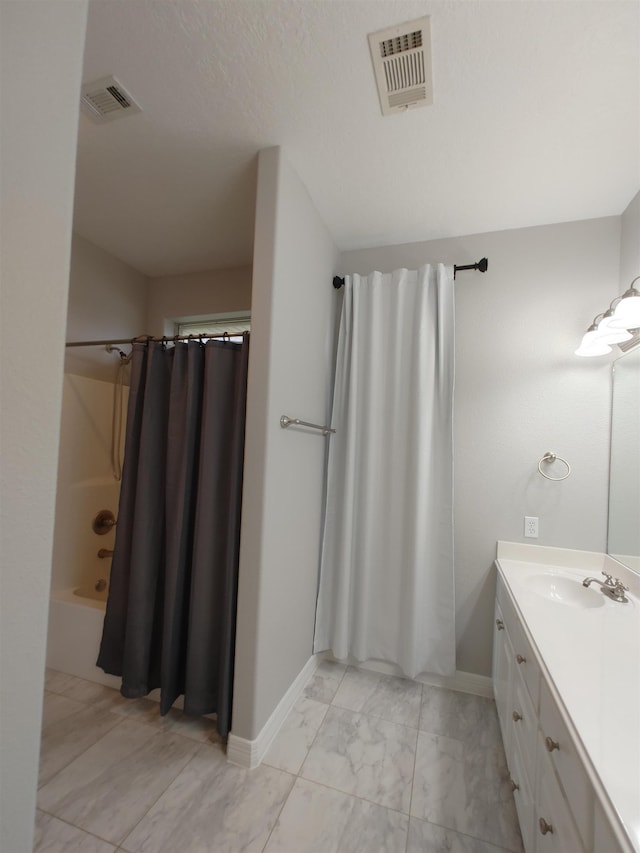 bathroom with vanity and shower / bath combo