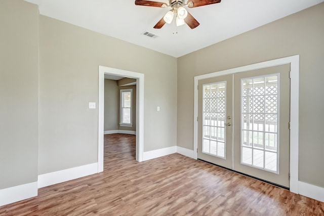 3500 32nd St, Port Arthur, TX 77642 - unfurnished room with french doors, light wood-style floors, and ceiling fan