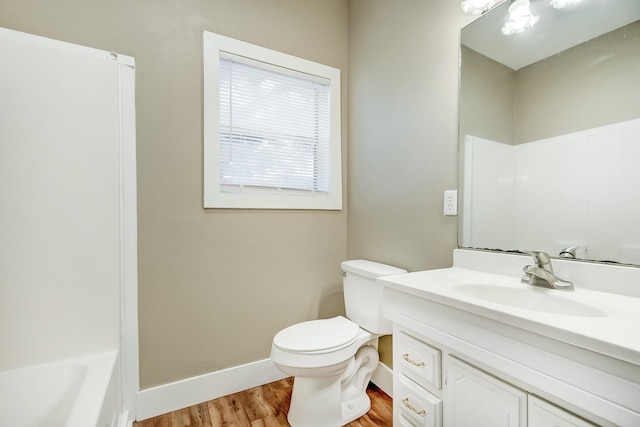 3500 32nd St, Port Arthur, TX 77642 - full bath with vanity, wood finished floors, and a tub to relax in