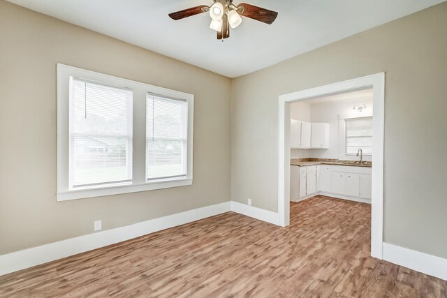 3500 32nd St, Port Arthur, TX 77642 - empty room featuring light wood-style flooring and a ceiling fan