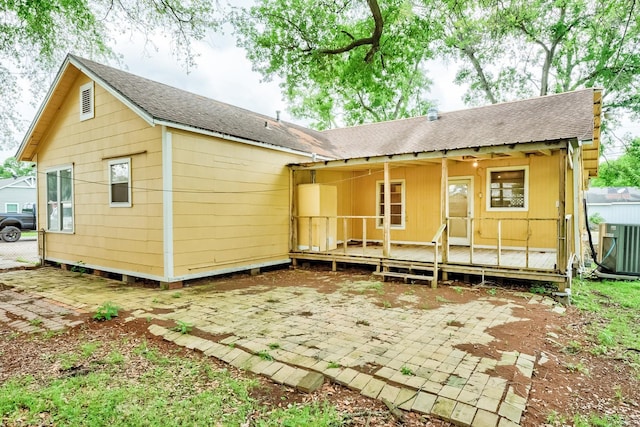 3500 32nd St, Port Arthur, TX 77642 - rear view of property with roof with shingles and a patio area