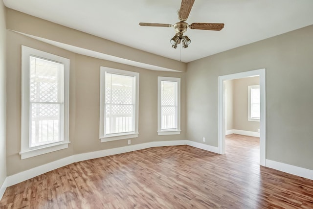 3500 32nd St, Port Arthur, TX 77642 - empty room with wood finished floors and a ceiling fan