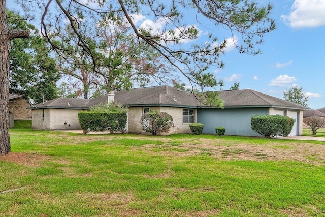 exterior space featuring a garage and a front yard