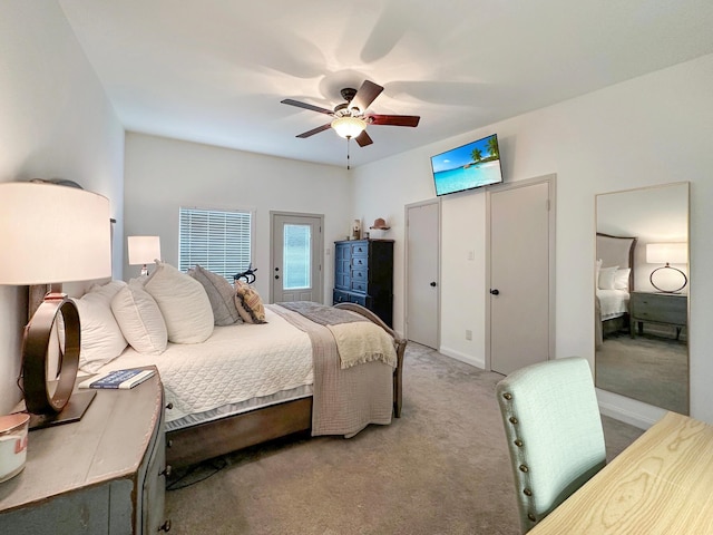 bedroom featuring ceiling fan and light colored carpet