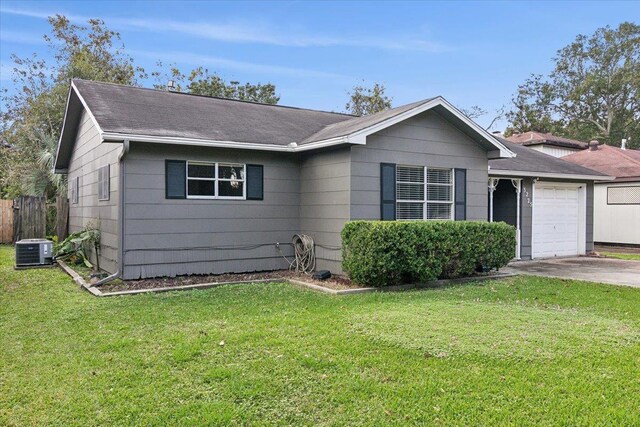 single story home featuring a front lawn, central AC unit, and a garage