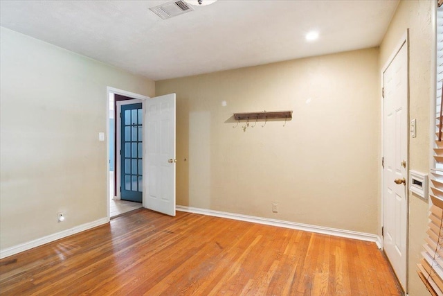 unfurnished room featuring light hardwood / wood-style flooring