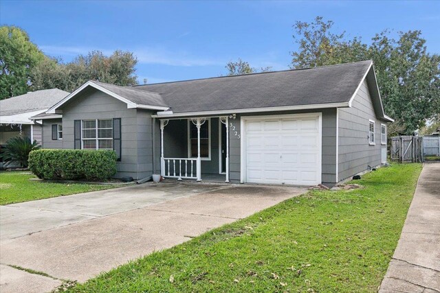 ranch-style home with a porch, a garage, and a front lawn