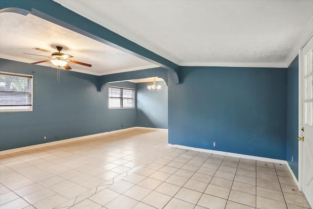 tiled empty room featuring crown molding and ceiling fan with notable chandelier