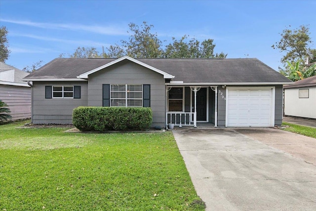 ranch-style house with covered porch, a garage, and a front yard