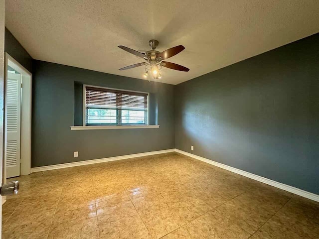 unfurnished bedroom featuring a textured ceiling and ceiling fan