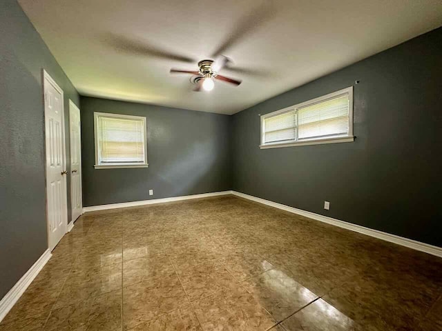 spare room featuring ceiling fan