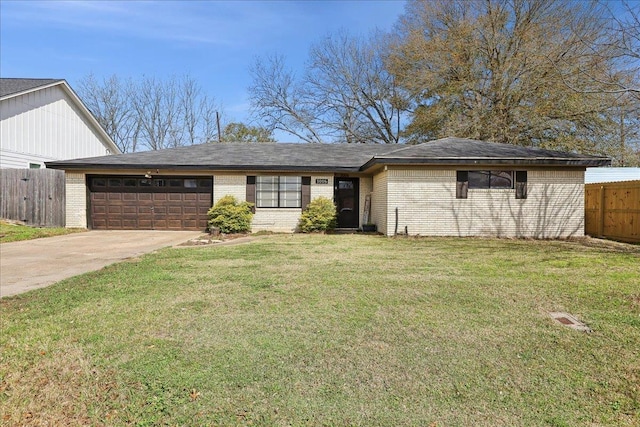 view of front of house featuring a garage and a front lawn