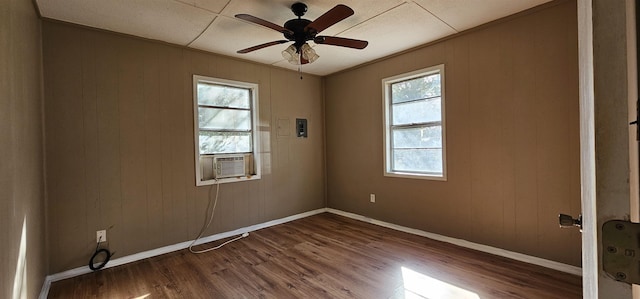 unfurnished room featuring cooling unit, ceiling fan, crown molding, and hardwood / wood-style flooring