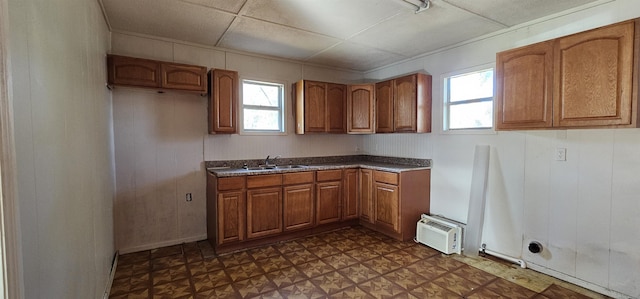 kitchen with wooden walls and sink