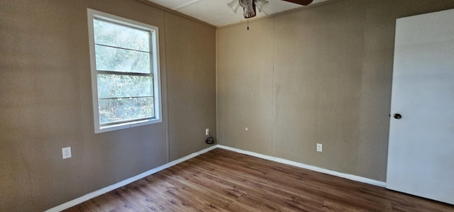 empty room featuring wood-type flooring and ceiling fan