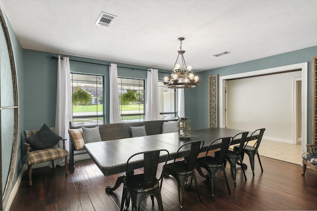 1025 Creek Bend Dr, Jasper, TX 75951 - dining room with a chandelier, dark wood-type flooring, and baseboards