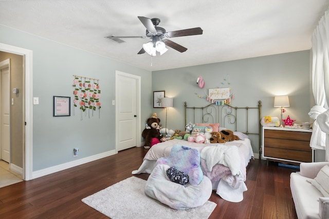 1025 Creek Bend Dr, Jasper, TX 75951 - bedroom with wood finished floors, baseboards, and a ceiling fan