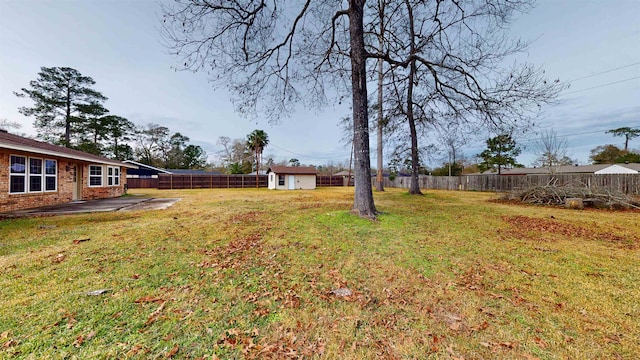 view of yard featuring a patio area and an outbuilding