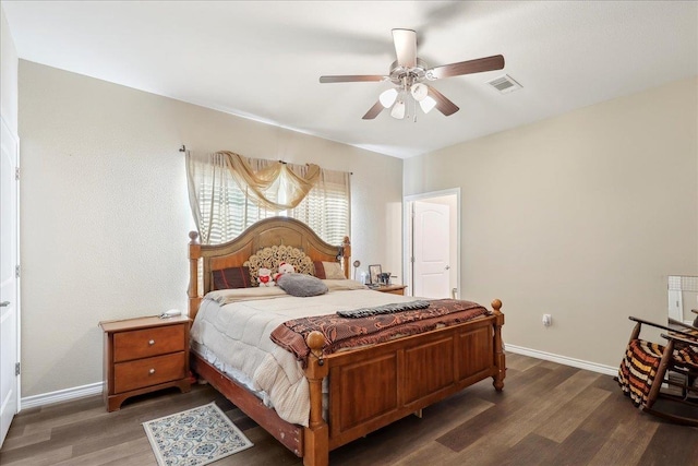 bedroom featuring a ceiling fan, baseboards, visible vents, and wood finished floors