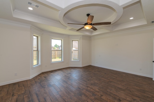 empty room featuring baseboards, visible vents, coffered ceiling, ornamental molding, and dark wood-type flooring