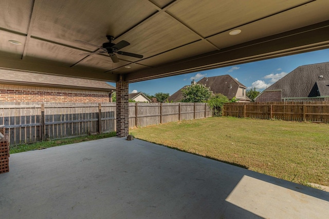 view of patio featuring a fenced backyard and a ceiling fan