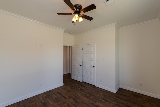 unfurnished bedroom featuring ceiling fan, dark wood-style flooring, visible vents, baseboards, and ornamental molding