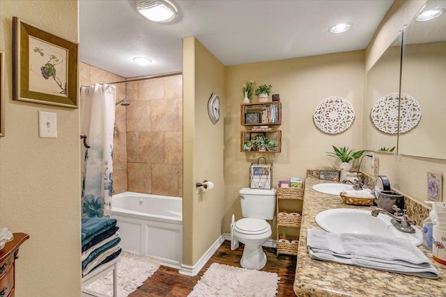 410 Christy Ln, Bridge City, TX 77611 - bathroom with wood finished floors, double vanity, and shower / bathtub combination with curtain