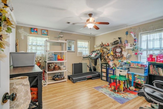 410 Christy Ln, Bridge City, TX 77611 - recreation room featuring ceiling fan, wood finished floors, and ornamental molding