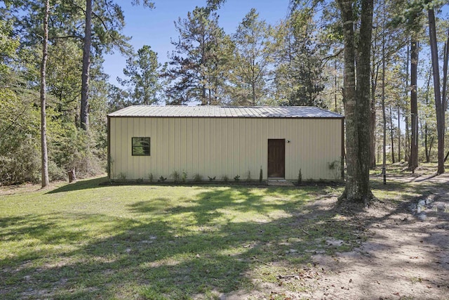 view of pole building with a yard