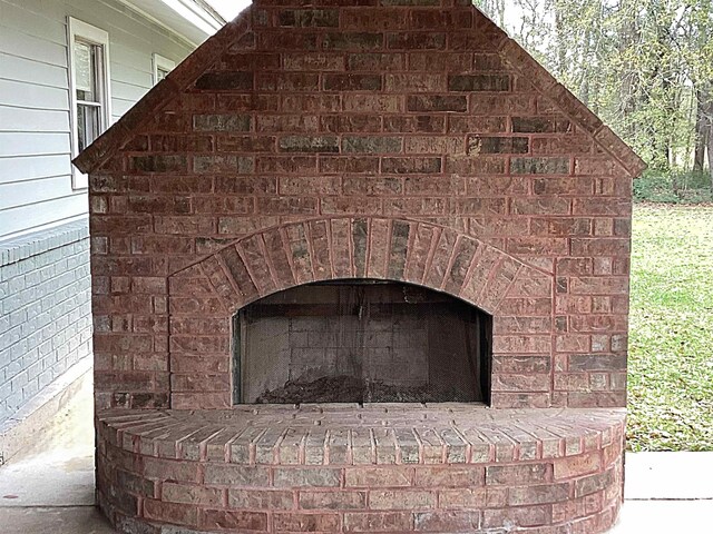 exterior details with a fireplace