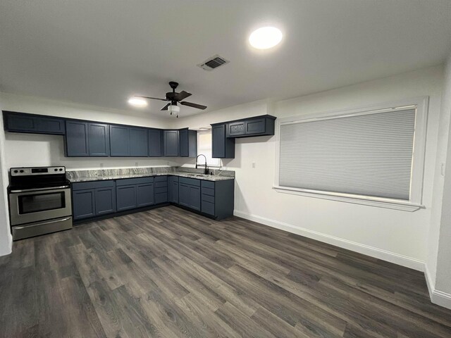 kitchen featuring ceiling fan, sink, dark hardwood / wood-style floors, and electric stove