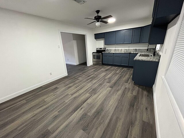 kitchen with dark wood-type flooring, sink, stainless steel electric range oven, ceiling fan, and light stone countertops