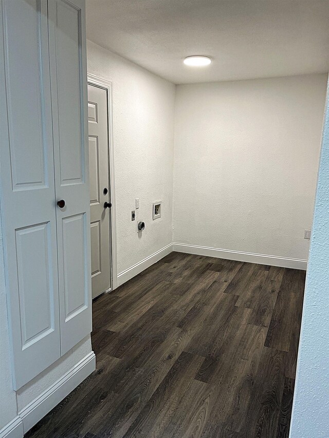 clothes washing area featuring dark hardwood / wood-style flooring