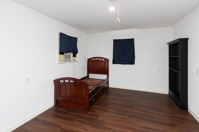 bedroom featuring dark hardwood / wood-style floors