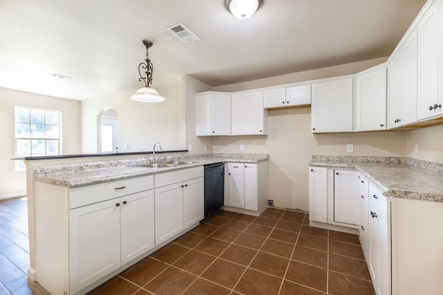 kitchen featuring white cabinets, decorative light fixtures, and black dishwasher