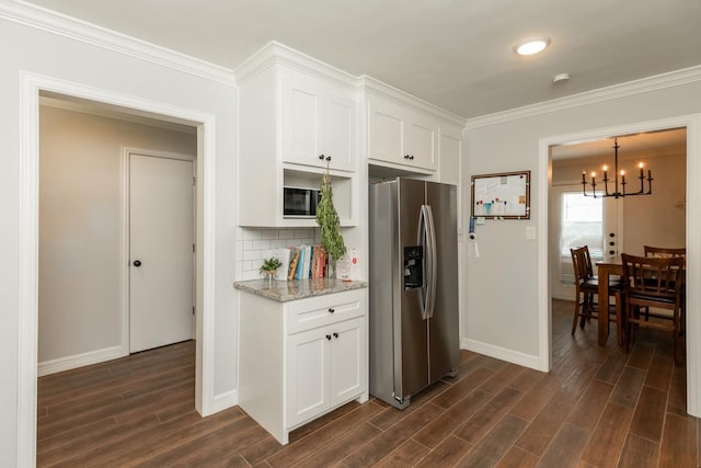 3750 Empire Row, Beaumont, TX 77706 - kitchen with stainless steel fridge, dark wood-type flooring, a chandelier, white cabinets, and crown molding