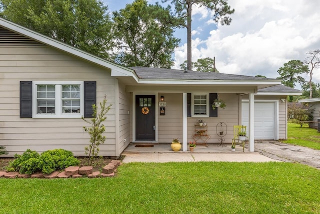 3750 Empire Row, Beaumont, TX 77706 - view of front of home featuring a porch, a front yard, driveway, and an attached garage
