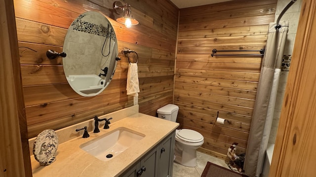 full bathroom featuring toilet, vanity, shower / tub combo with curtain, and wood walls