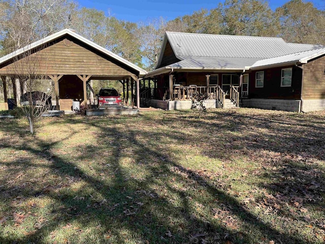 exterior space with covered porch and a front lawn