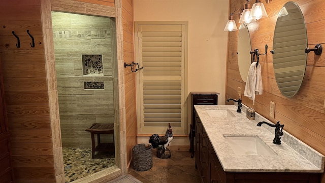 bathroom with vanity and wood walls