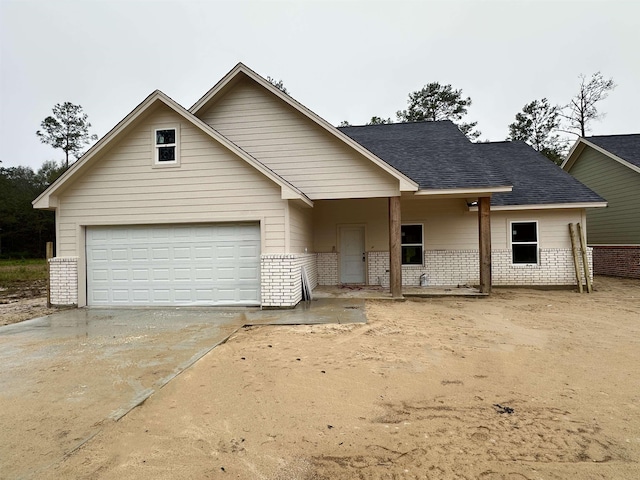 view of front of property with a garage