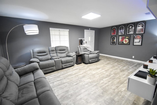 home theater room featuring wood-type flooring