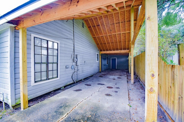 view of property exterior with a carport