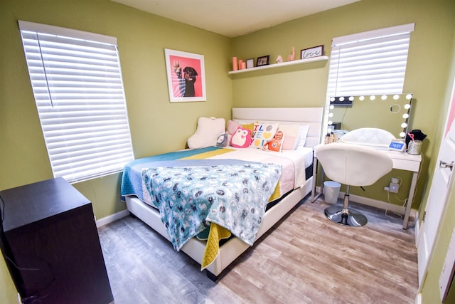 bedroom with wood-type flooring